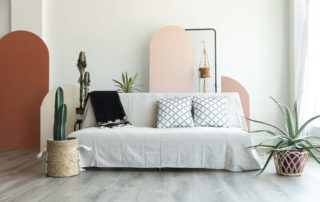 a natural canvas couch in a natural light photography studio