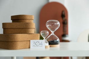 two hourglasses and natural details with a 304 Collective business card