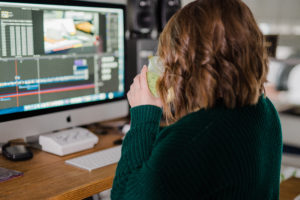 a videographer edits in her studio in fairmont wv